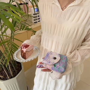 Floral mini organizer pouch with tulip pattern, snap button closure and side hook detail