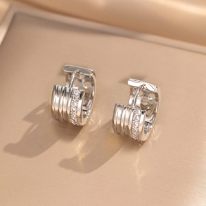 Elegant C-shape silver earrings featuring double rows of inlaid white zircon stones