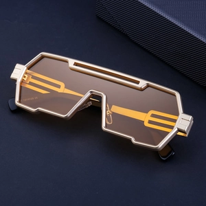Macro detail of steampunk sunglasses featuring golden brushed metal frame and hollow temple