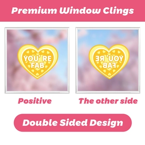 Double-sided yellow heart window cling with YOU'RE FAB text and double-sided design
