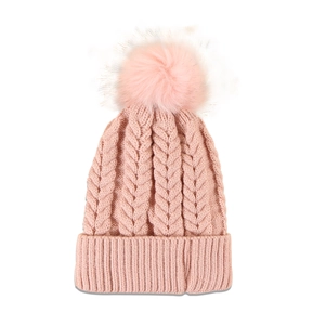Detail of pink knitted beanie featuring cable knit patterns and a fluffy pom-pom top