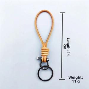 Detail showing ginger leather braided key ring with dimensions 14cm and horseshoe buckle