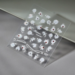 5D embossed nail art stickers with white floral patterns, pearls and rhinestone details