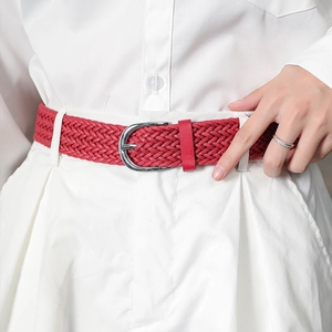 Braided red wax cord waist belt with vintage metal buckle on white jeans for women
