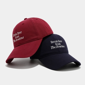 Classic burgundy and navy baseball caps with white letter embroidery on a soft cotton twill