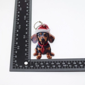 Size demonstration of the dachshund keychain with ruler showing 40mm x 50mm dimensions