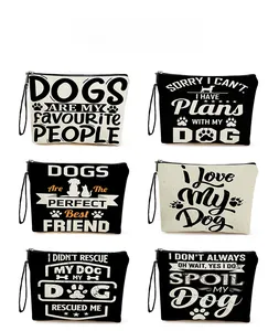 Detail view of canvas makeup bags with diverse pet-themed prints and zipper closures