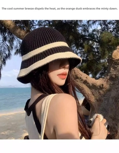 Close-up of a striped knitted bucket hat showing cotton texture at a beach location