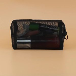 Detail view of black mesh cosmetic bag featuring durable zipper and large storage space