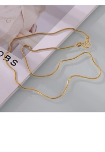 Detail of gold-plated snake chain necklace with S-hook clasp on a minimalist background