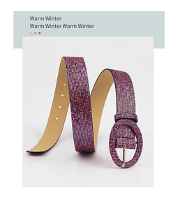 Detail of glittery purple belt with matching oval buckle and high-density sequin finish