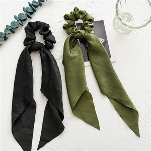 Floral print scrunchies with long ribbons in black and olive green colors