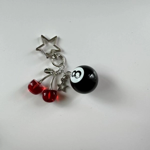 Handmade cherry keychain with red crystal charm, black number 8 ball and silver star pendant