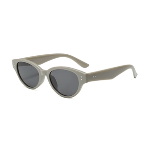 Cat eye sunglasses with grey acetate frames and metal rivet accents on white background