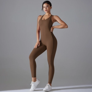 Detailed view of women's ribbed brown yoga jumpsuit with U-neck and bodycon fit