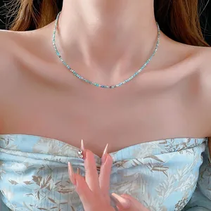 Minimalist Amazonite beaded necklace with silver spacers on a female model