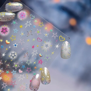 Macro detail of 3D embossed nail art stickers with laser stars and heart patterns