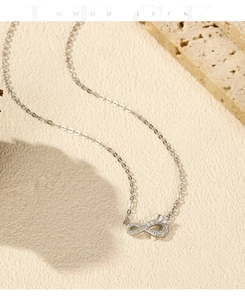 Close-up of S925 sterling silver infinity pendant with pavé crystal settings on O-chain
