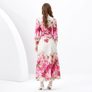 Elegant long-sleeved floral maxi dress with pink rose print and waist belt detail