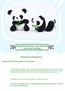 Detailed close-up of plush panda toy with bamboo leaf showing soft fabric texture