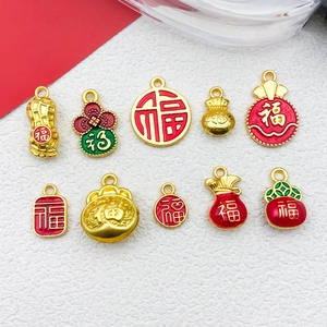 Detailed view of ten gold-colored Chinese lucky pendants with red and green enamel accents