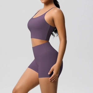 Detail view of the side profile showing dark purple brushed yoga set with high waist shorts