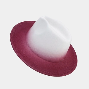 Detail of gradient felt jazz hat transitioning from white crown to wine red brim