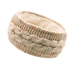 Winter knitted thermal headband with fleece lining and colorful polka dots on beige yarn