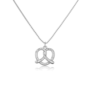 Detail of silver pretzel pendant necklace with sparkling stones on a white background