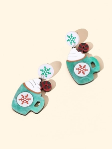 Detail of Christmas tree earrings with marble texture mint green and candy cane charms