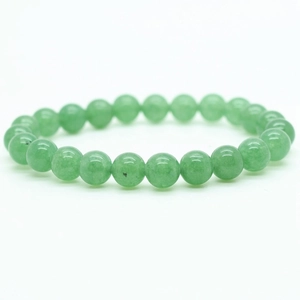 Detail view of 8mm green tiger eye agate beads with natural texture on a beaded bracelet