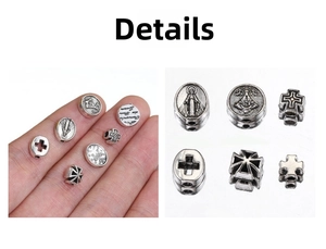Macro shot of antique silver beads featuring religious cross and portrait engravings for DIY