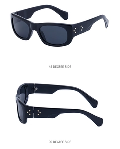Detail view of black square sunglasses featuring gold star rivets and side profiles