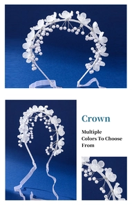 Close-up of white acrylic flower headband with pearls and delicate satin ribbons