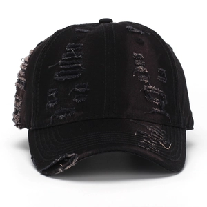 Retro distressed black washed denim baseball cap with vintage frayed holes and street style