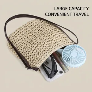 Handwoven summer straw tote bag with brown straps and large capacity for travel