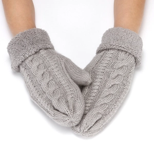 Close-up of grey cable knit fingerless gloves with soft plush faux fur cuffs