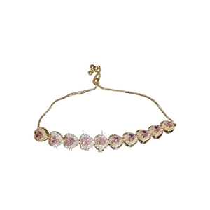 Luxurious gold chain bracelet with pink heart-shaped gems and micro-pave crystals