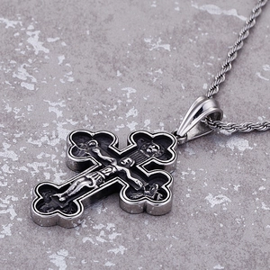 Vintage silver steel cross pendant necklace with religious relief and braided rope chain