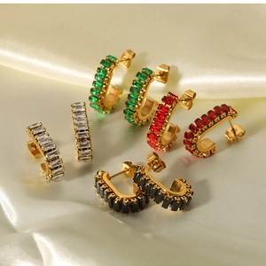 Detail of four pairs of 18K gold-plated stainless steel earrings with square gemstones