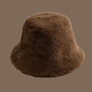Detailed close-up of thick brown faux fur bucket hat with fluffy winter texture