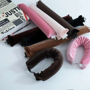 Flat lay of 3cm velvet heatless hair rollers in pink, brown and black with hook closure