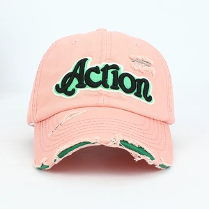 Detailed close-up of pink distressed baseball cap with Action 3D letter embroidery