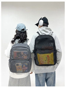 Detail view of large mesh backpack in grey and black showing breathable nylon fabric