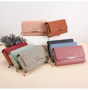 Detail view of multi-color long wallets with double zippers and elegant metal accents