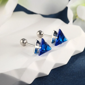 Macro shot of triangle blue gemstone earrings with secure screw-back ball closure