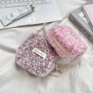 Plush leopard print sanitary pouch in pink and purple with zipper for daily essentials