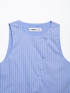 Detail shot of the V-neckline and inner label on a blue striped sleeveless top