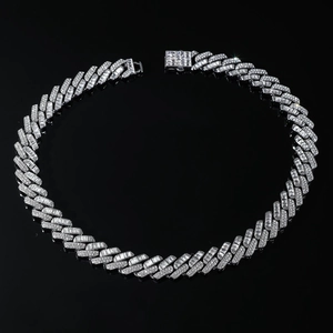 Macro detail of silver iced out Cuban link chain with square diamond clasp close-up