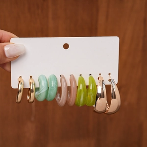 Set of 6 acrylic and metal hoop earrings in marble green, pink, and gold tones